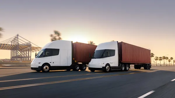 A white, electric battery 8 truck.