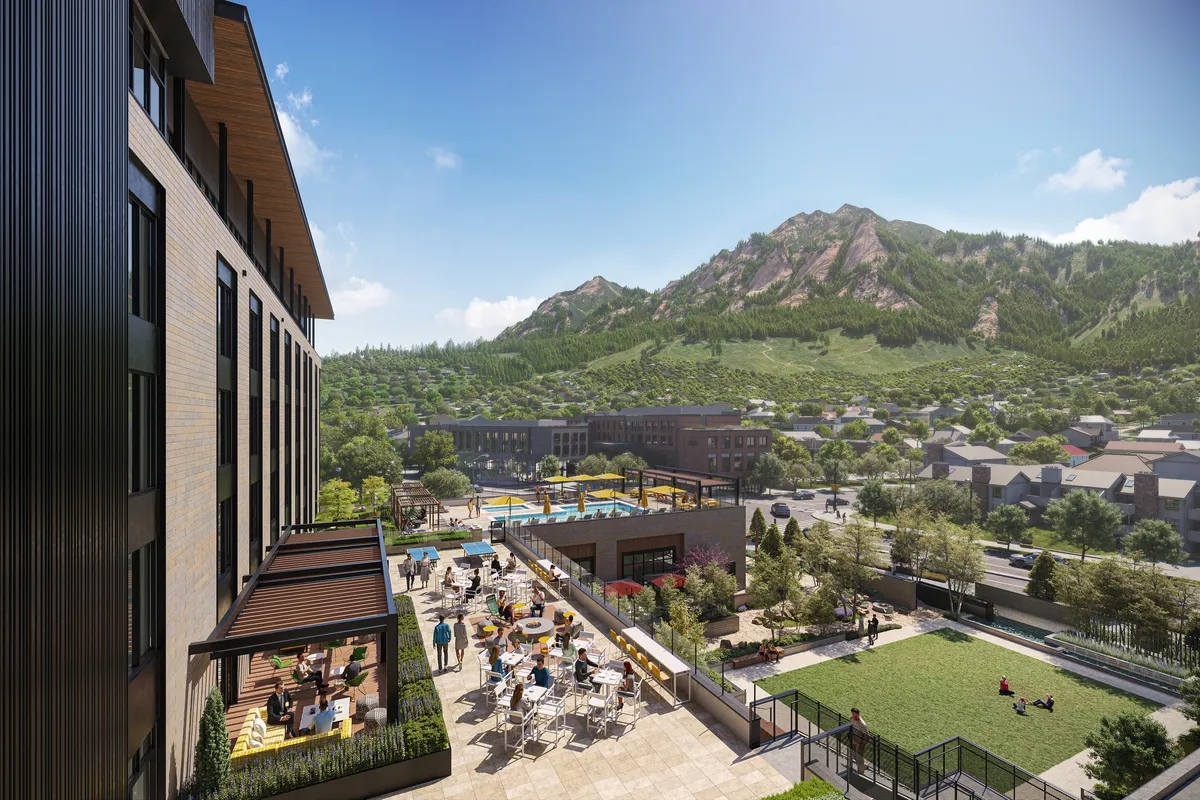 A rendering of the hotel with mountains in the background.