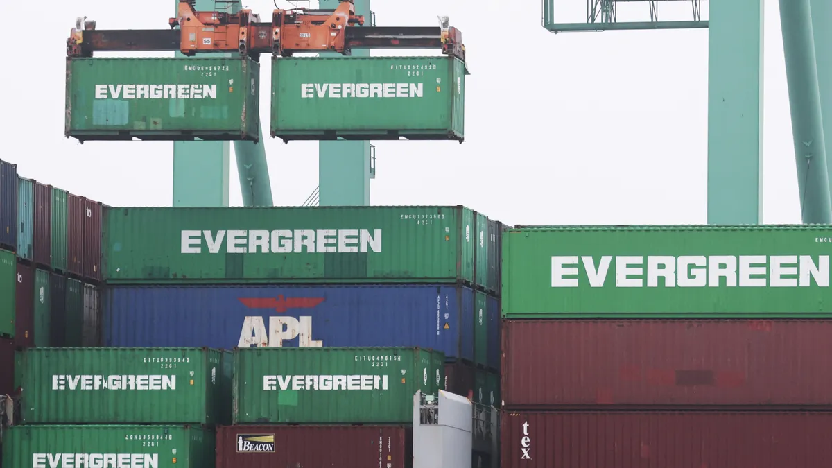 Shipping containers are offloaded from a container ship in the Port of Los Angeles on June 10, 2022 .