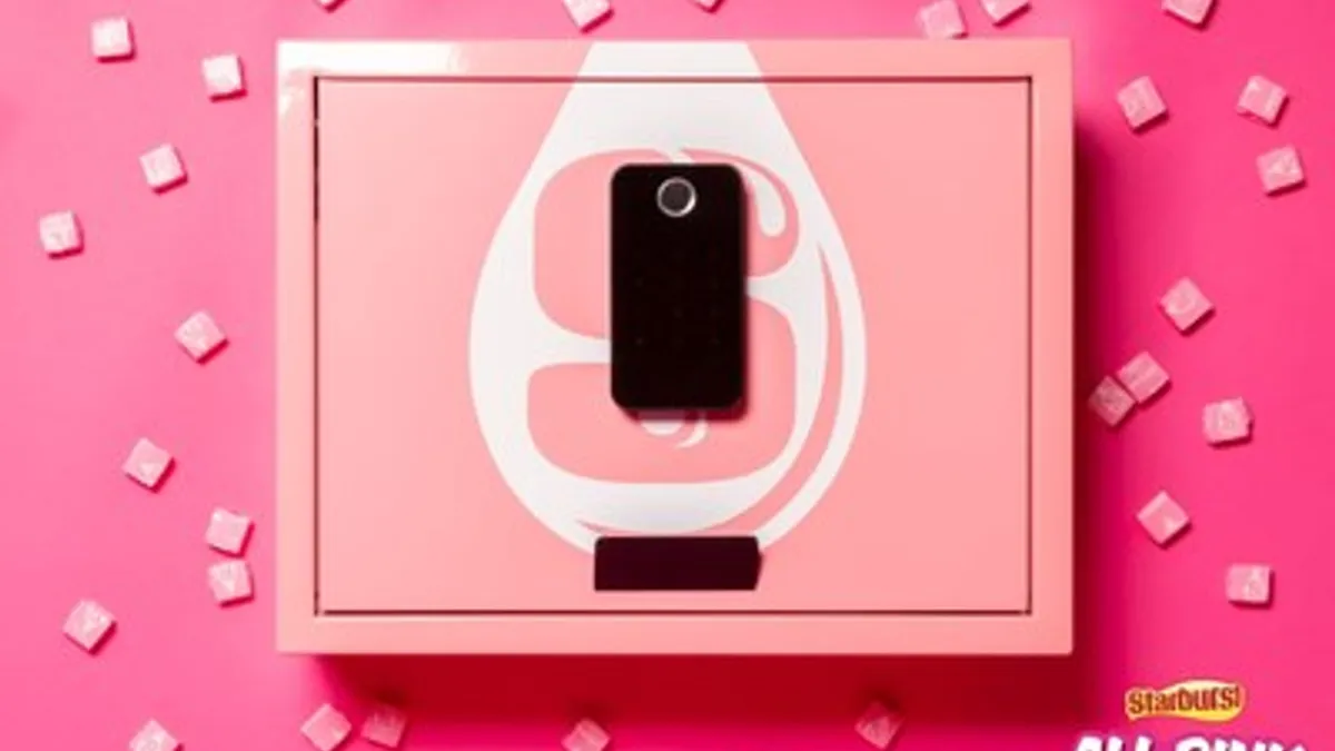 A pink biometric safe with the Starburst logo against a pink background surrounded by pink Starbursts.