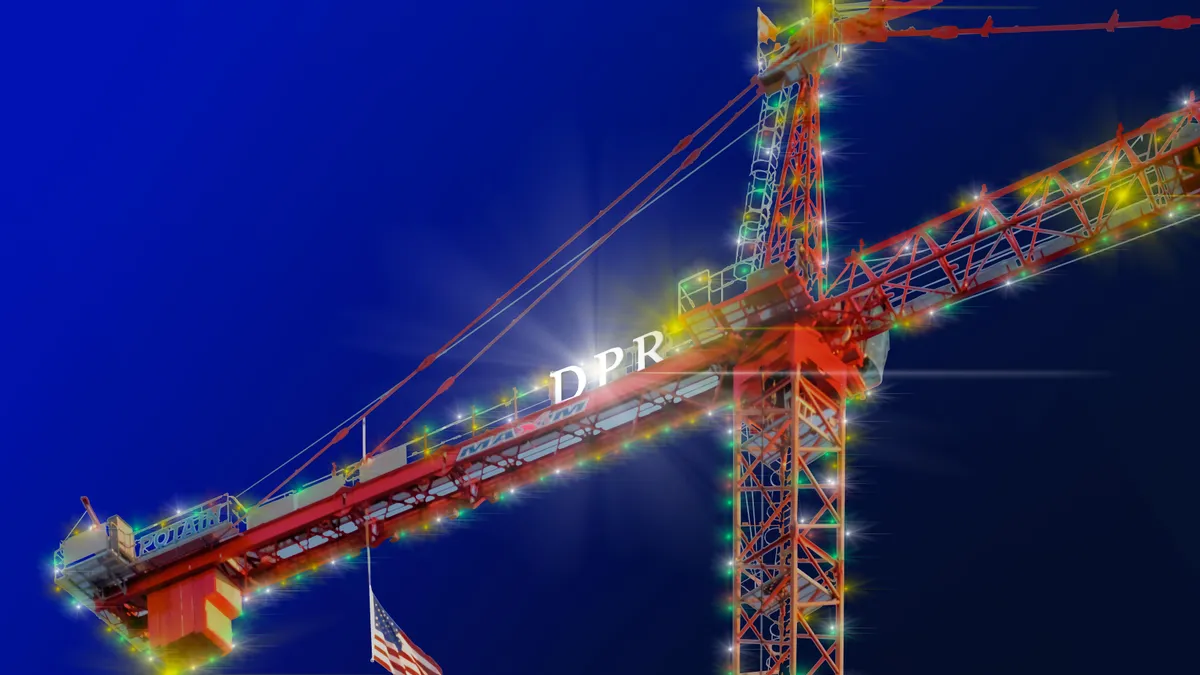 A crane, lit up with holiday lights, shines in the sky. The logo of DPR Construction is visible on the crane.