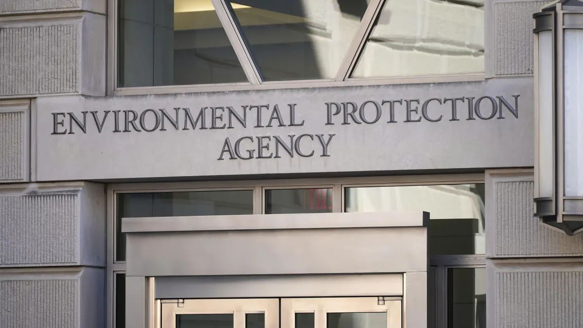 Entrance to a neoclassical building facade that reads "Environmental Protection Agency. "