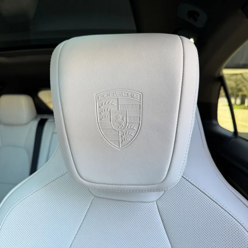 The Porsche Crest is proudly embedded into the Macan 4S electric's front and rear headrests.