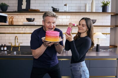 Gordon Ramsay and his daughter holding cake and a makeup brush for the NYX partnership.