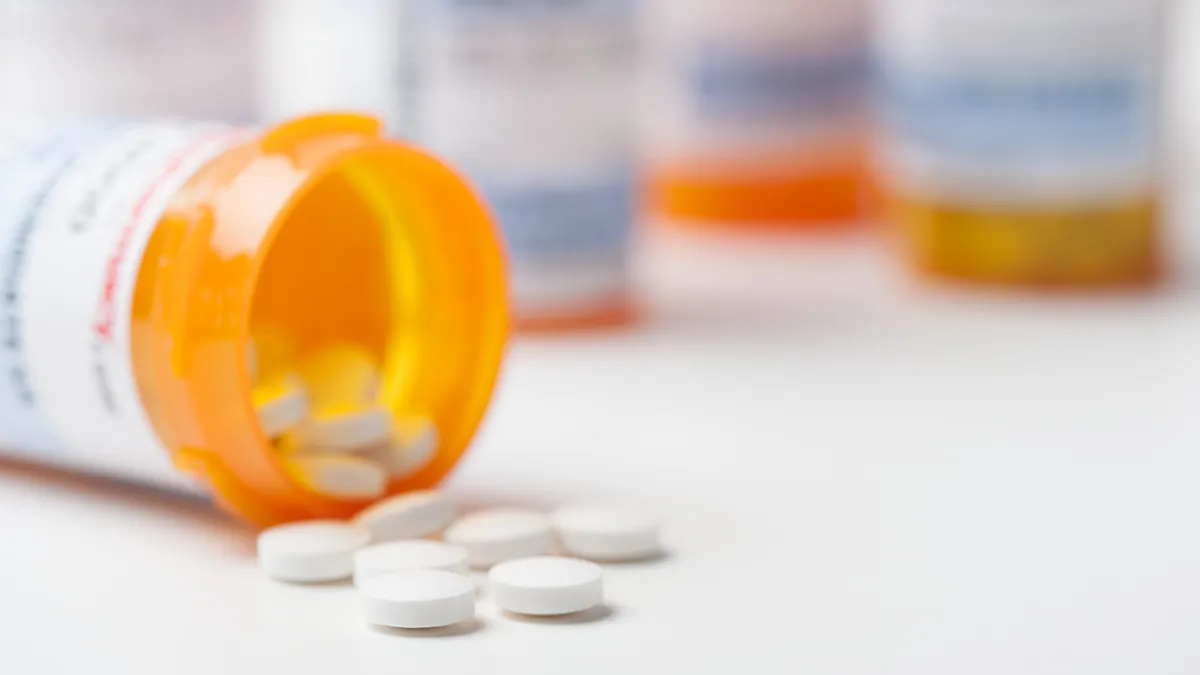 Prescription pills scattered on a table.