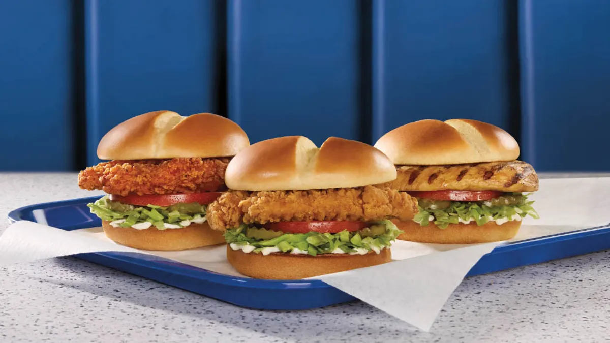 A photograph of three chicken sandwiches