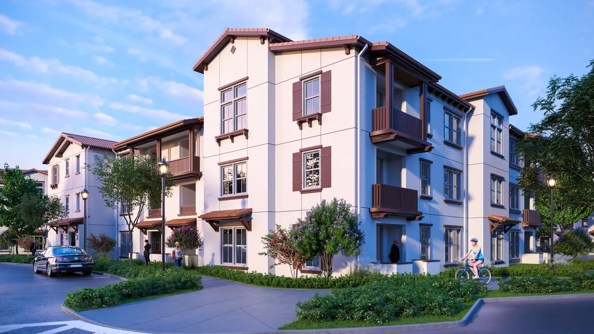 A low-rise apartment building with sloped roofs.