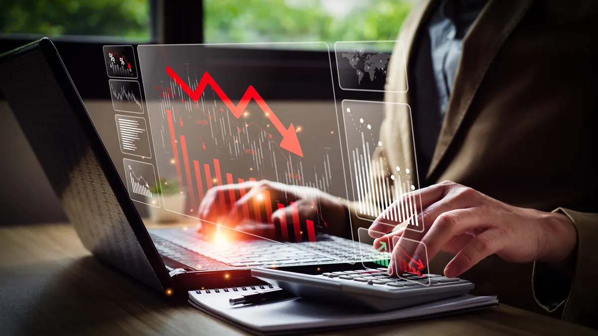 business person with falling financial graph chart