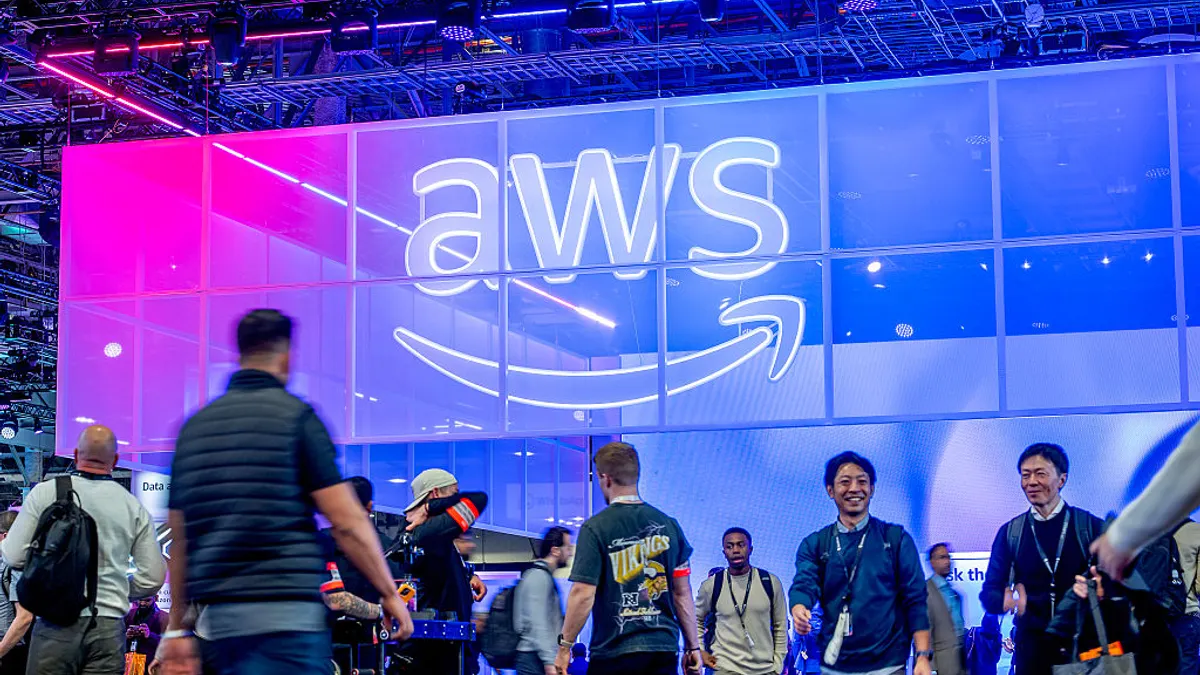 Attendees walk through an expo hall during AWS re:Invent 2025, a conference hosted by Amazon Web Services, at The Venetian Convention & Expo Center on December 2, 2025 in Las Vegas, Nevada.