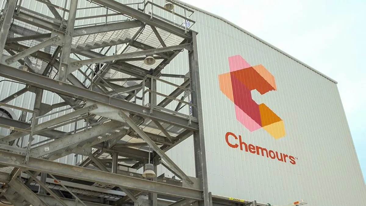 A tan facility with The Chemours Co logo on the front.