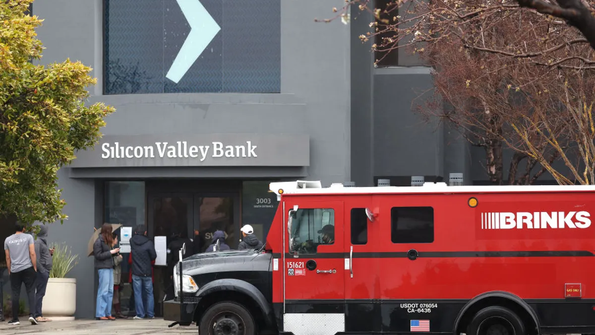 An armored Brink's truck is parked in front of Silicon Valley Bank.