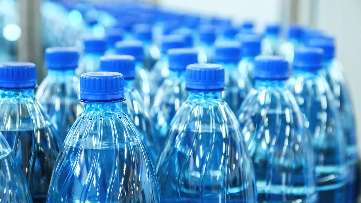 Conveyor belt of plastic water bottles