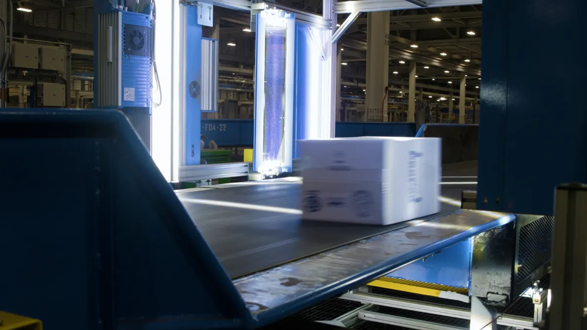 A package moves through a six-sided scanning tunnel at FedEx's Secondary 25 facility in Memphis, Tennessee.