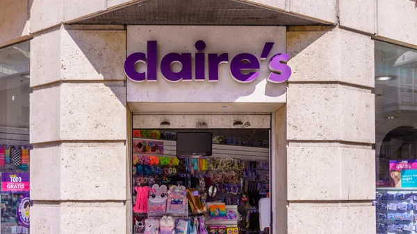 A Claire's storefront with an open door showing brightly colored accessories inside
