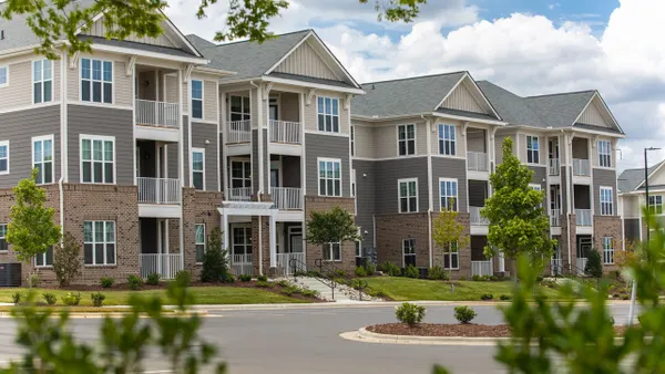 Tan and brick garden-style apartments