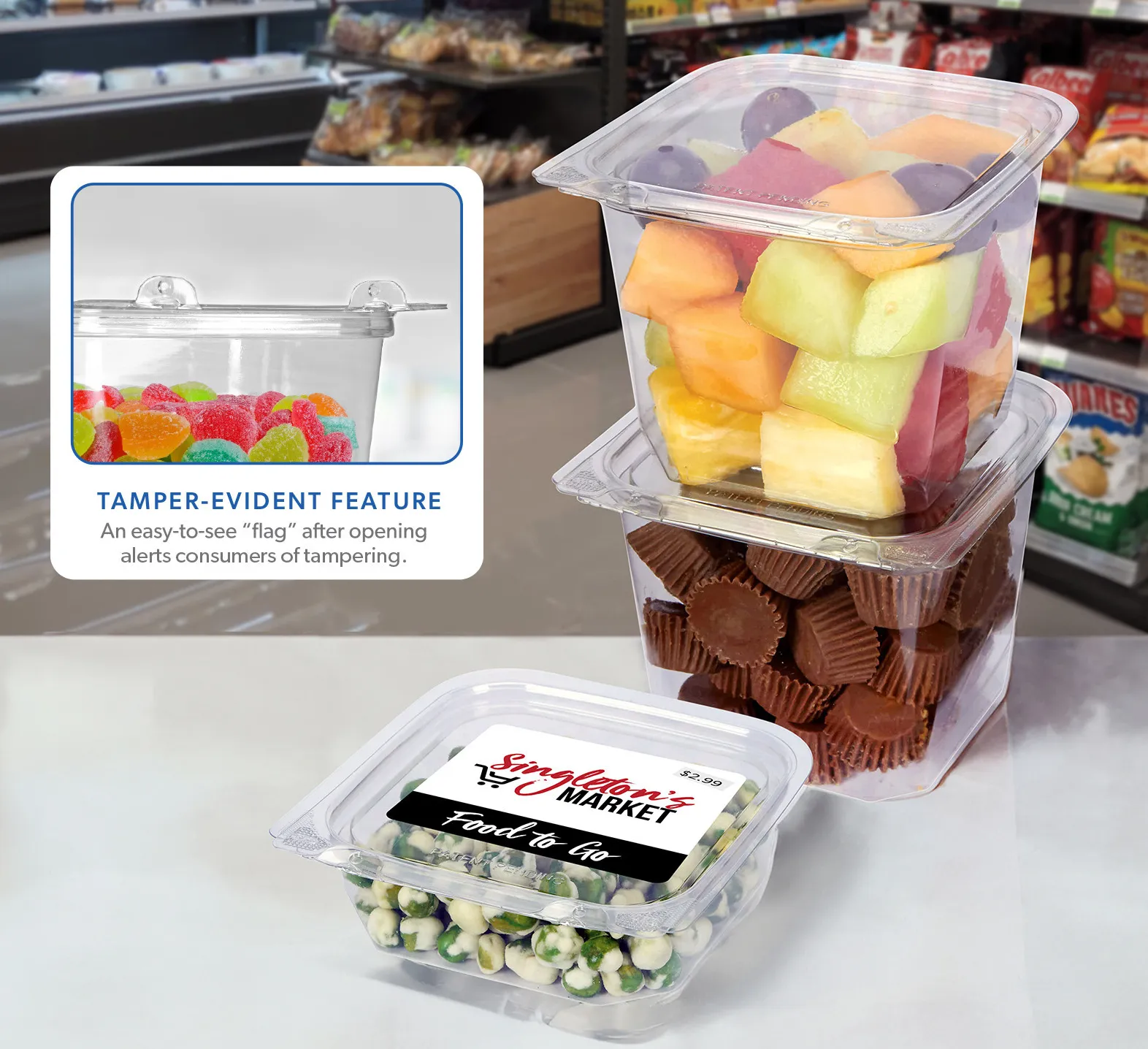 A clear, rigid plastic container with food inside placed in a grocery store environment.