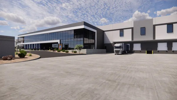 A rendering of an building with a truck next to a loading door.