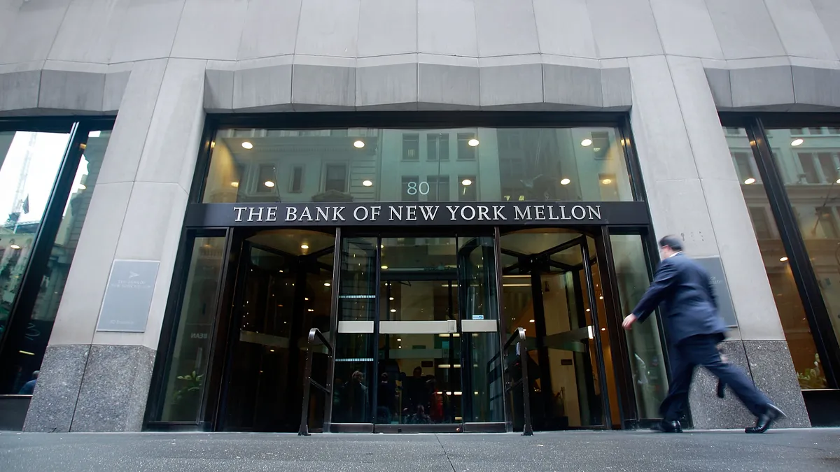 A person walks into BNY Mellon's headquarters in New York City.