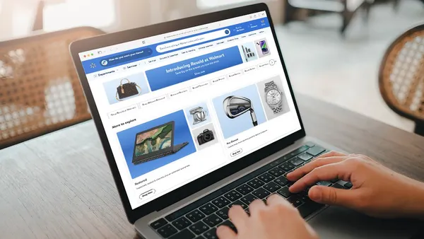 Laptop featuring the Walmart Marketplace website.