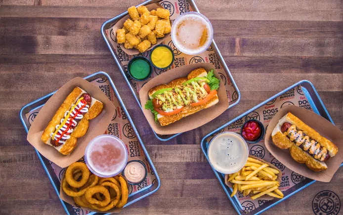 Dog Haus signs 50-unit deal, adds new execs