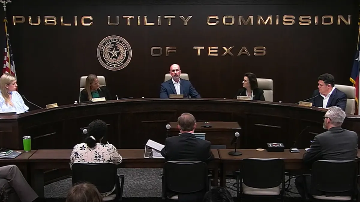 Five commissioners of the Public Utility Commission of Texas sit at a table. They met on June 18, 2026.