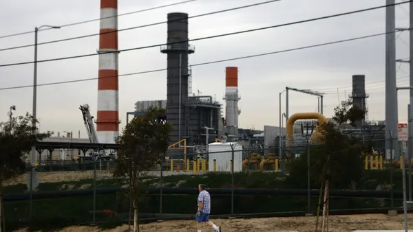 A man walks past the Scattergood Generating Station on February 12, 2019 in El Segundo, California.