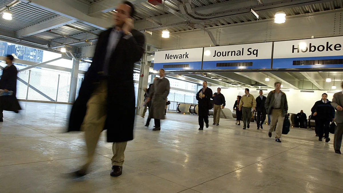 Passengers arrive at the Port Authority Transportation Hudson subway train station.