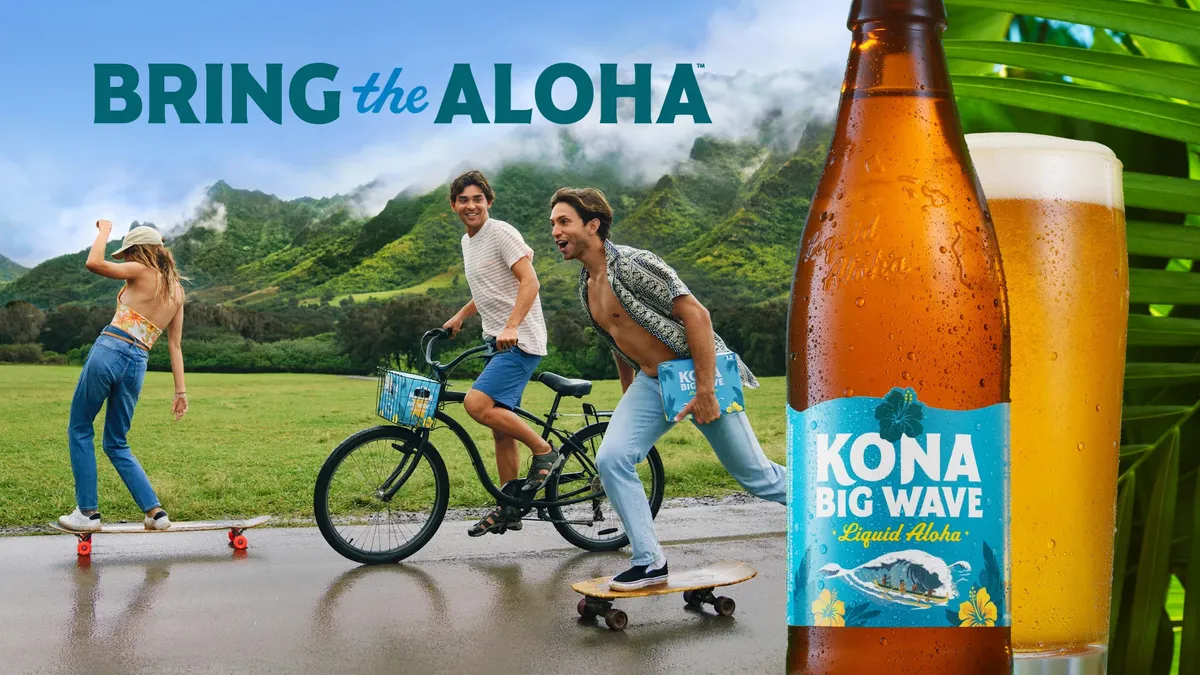 A group of people on bikes and skateboards ride a road near a mountain range.