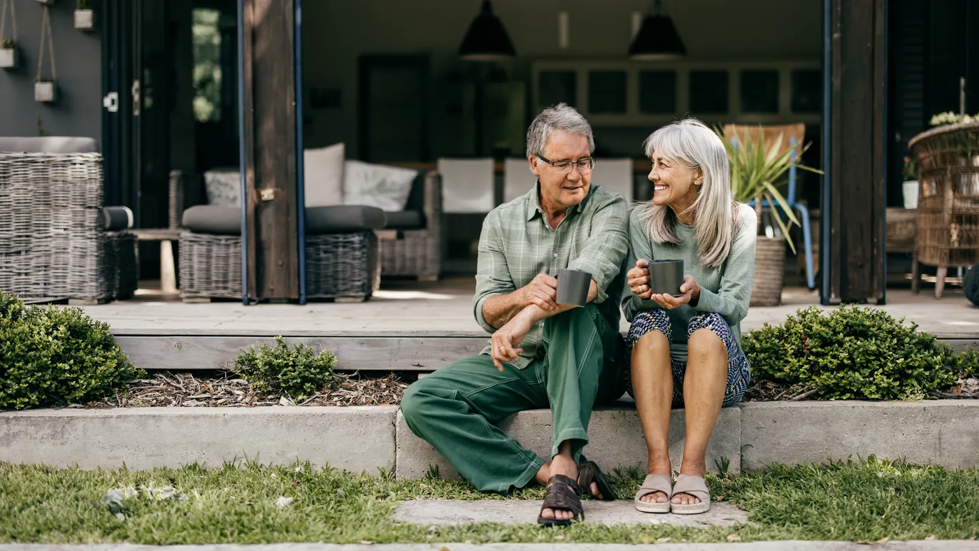 people sitting on stairs drinking coffee