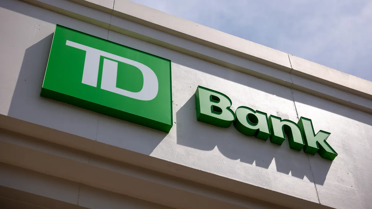 Green and white signage on the exterior of a building reads "TD Bank."