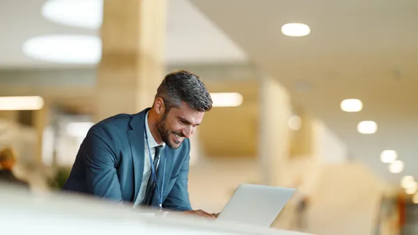 A Business person is using a laptop