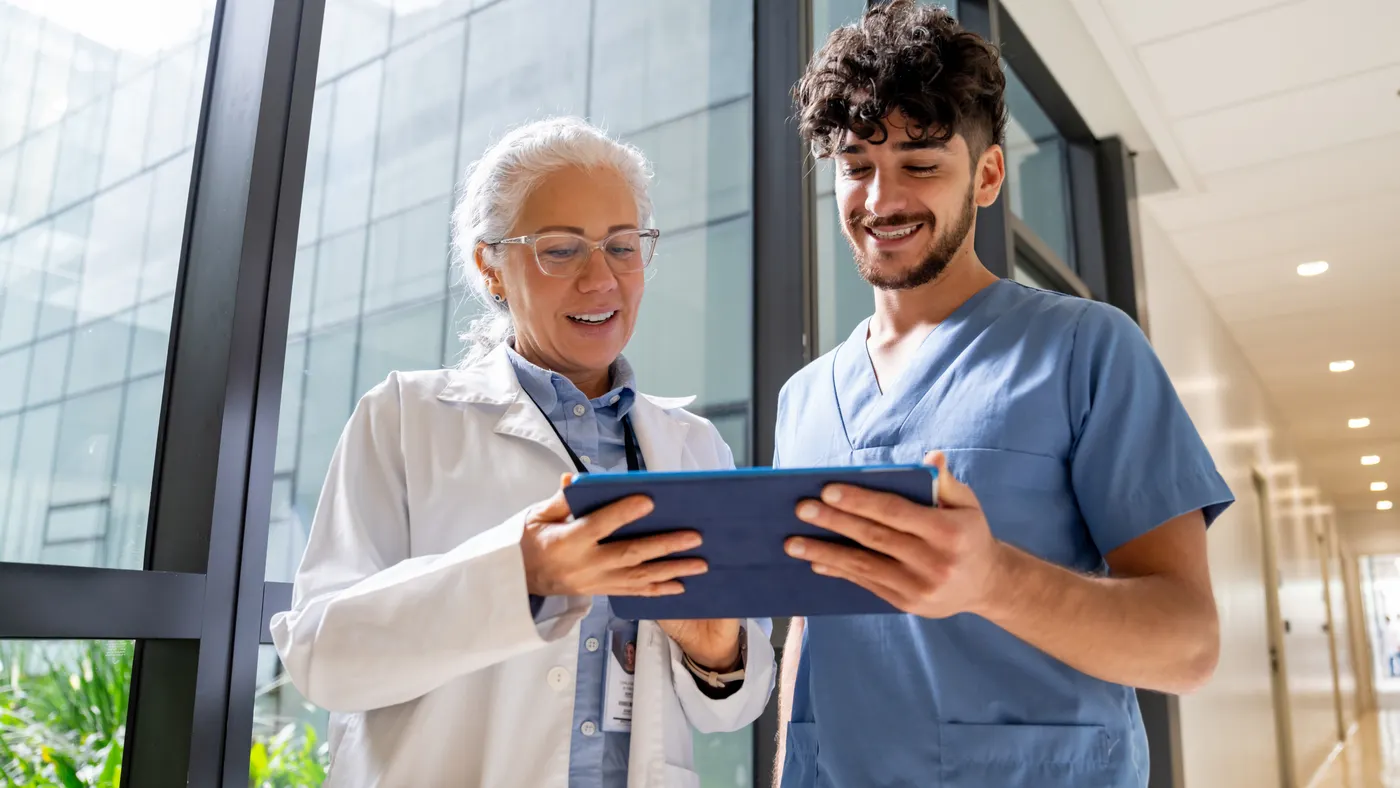 Doctor and nurse looking at tablet together