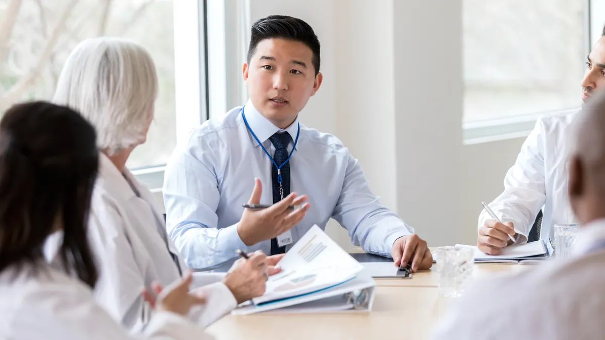 Hospital administrator is having a meeting