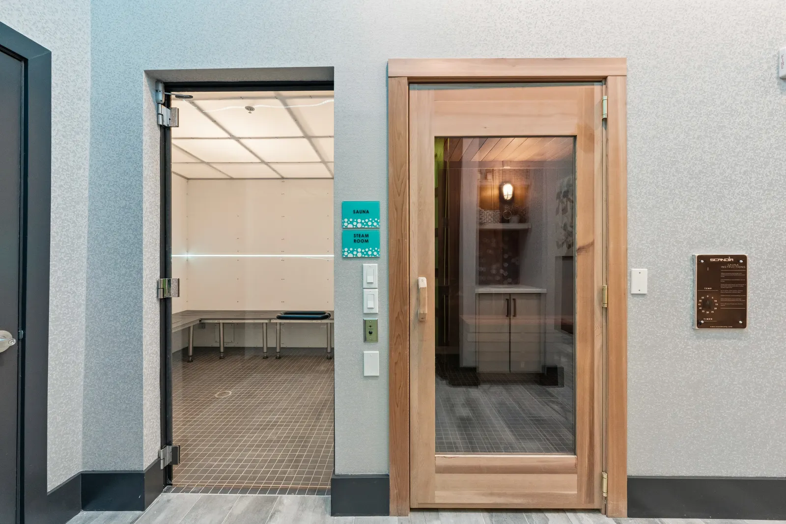 Two doors lead to a sauna and steam room.