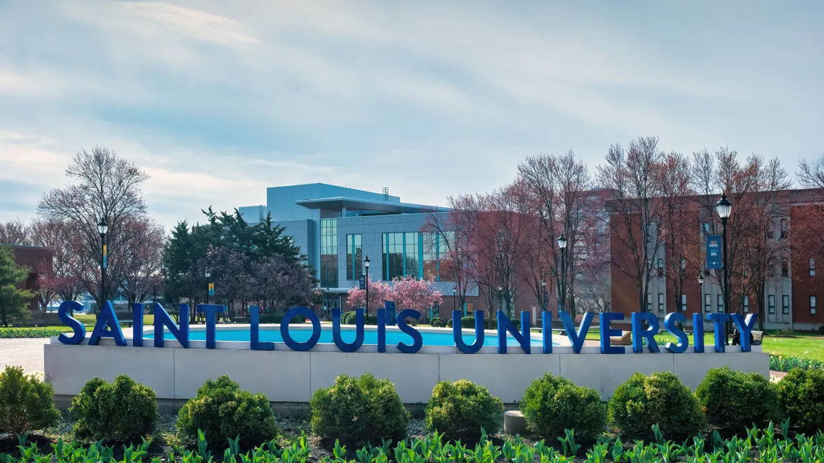 A sign bearing Saint Louis University's name at its campus.