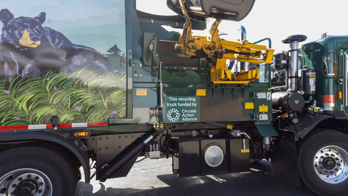 Truck with sign that states "This recycling truck funded by Circular Action Alliance"