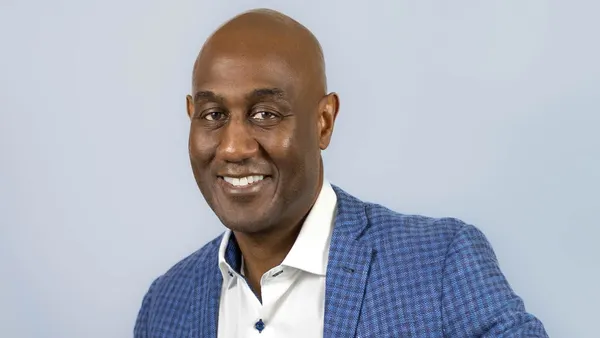 An image of a person wearing a blue suit