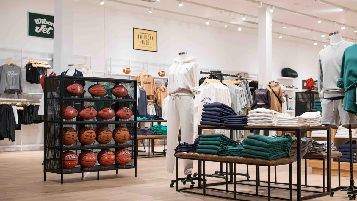 Mannequins wearing white sweaters at a Wilson store