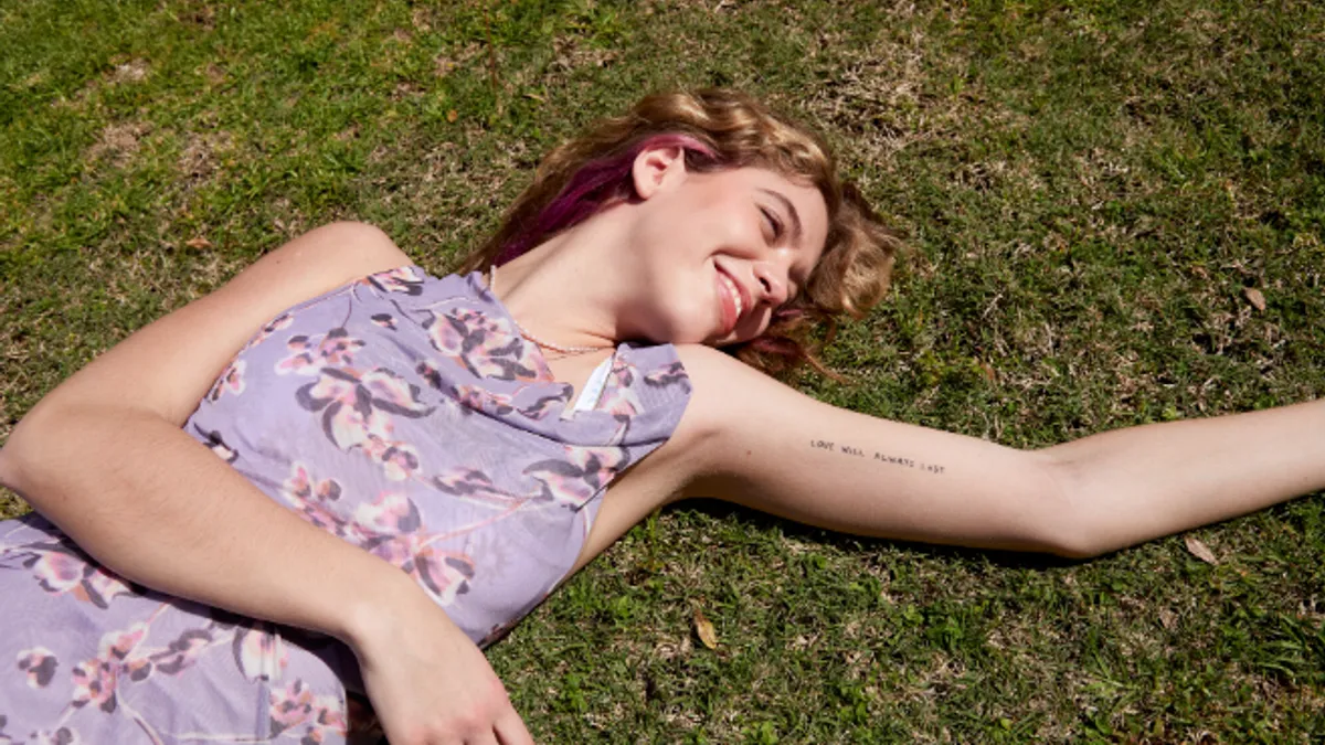 Person wearing Pacsun in the grass.