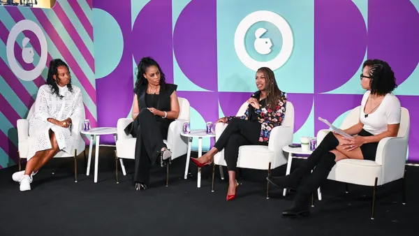 Several panelists discuss brand values on stage during a session at Advertising Week NY.