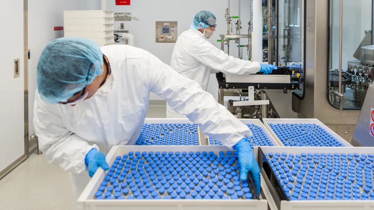 Unloading filled vials of investigational remdesivir, photo by GIlead Sciences