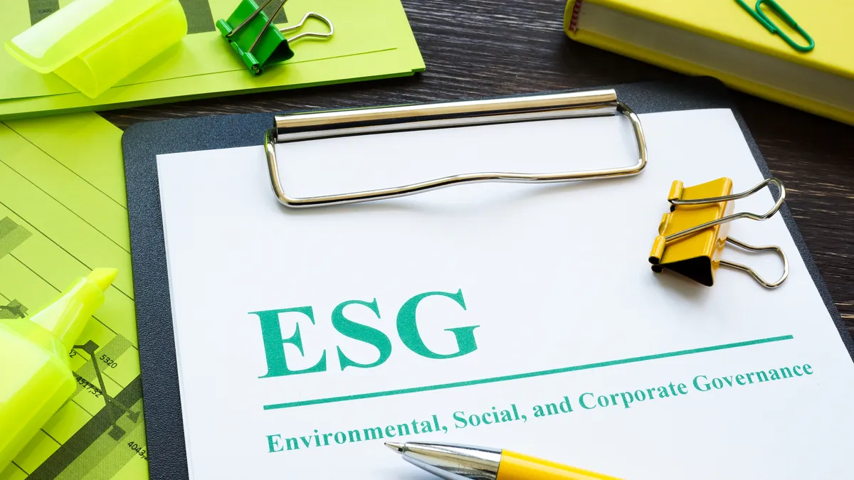 Papers about ESG Environmental, Social and Corporate Governance and notepad.