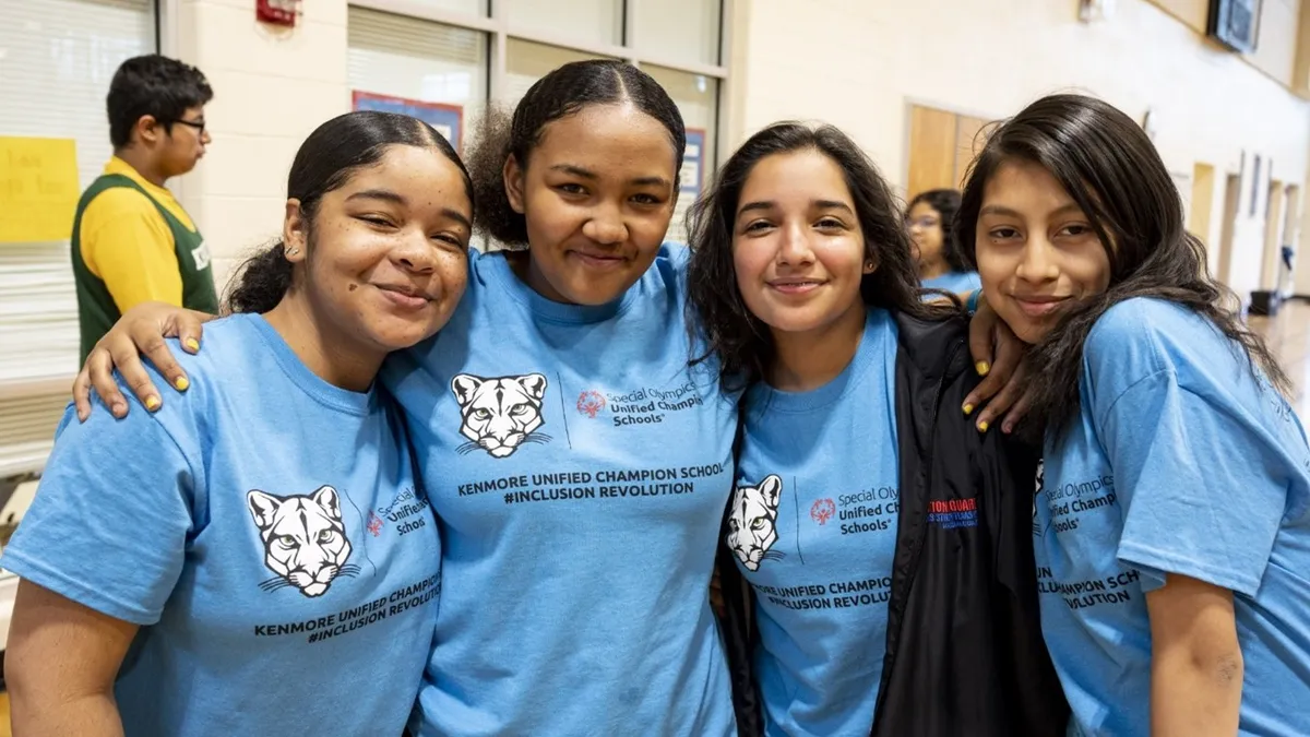 Three participants in Special Olympics Unified Champion Schools