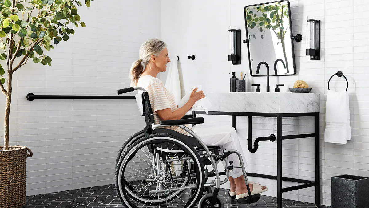 A person using Pottery Barn's Clarence Vanity.