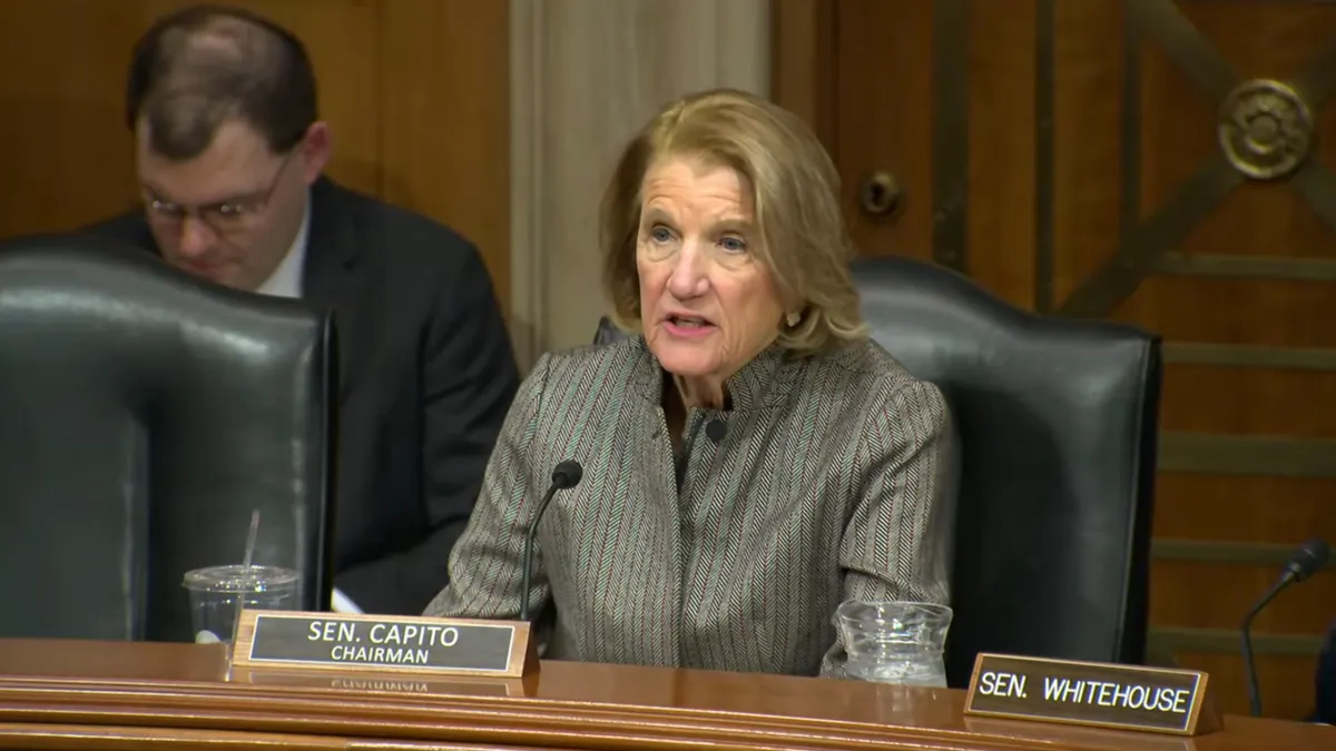 Sen. Shelley Moore Capito speaks from behind a desk
