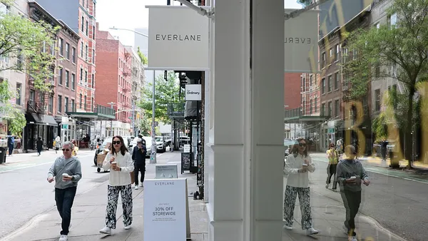 People walking down a city street.