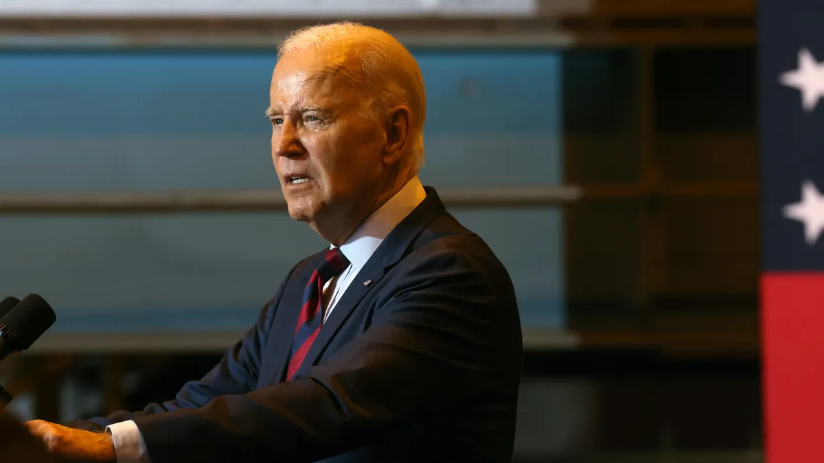 US President Joe Biden speaks at a podium