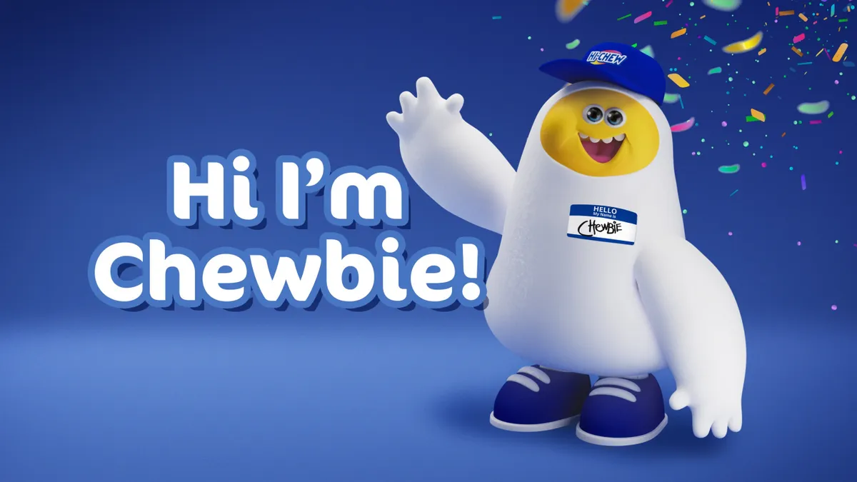 Hi-Chew's new Chewbie Mascot waves against a blue background.