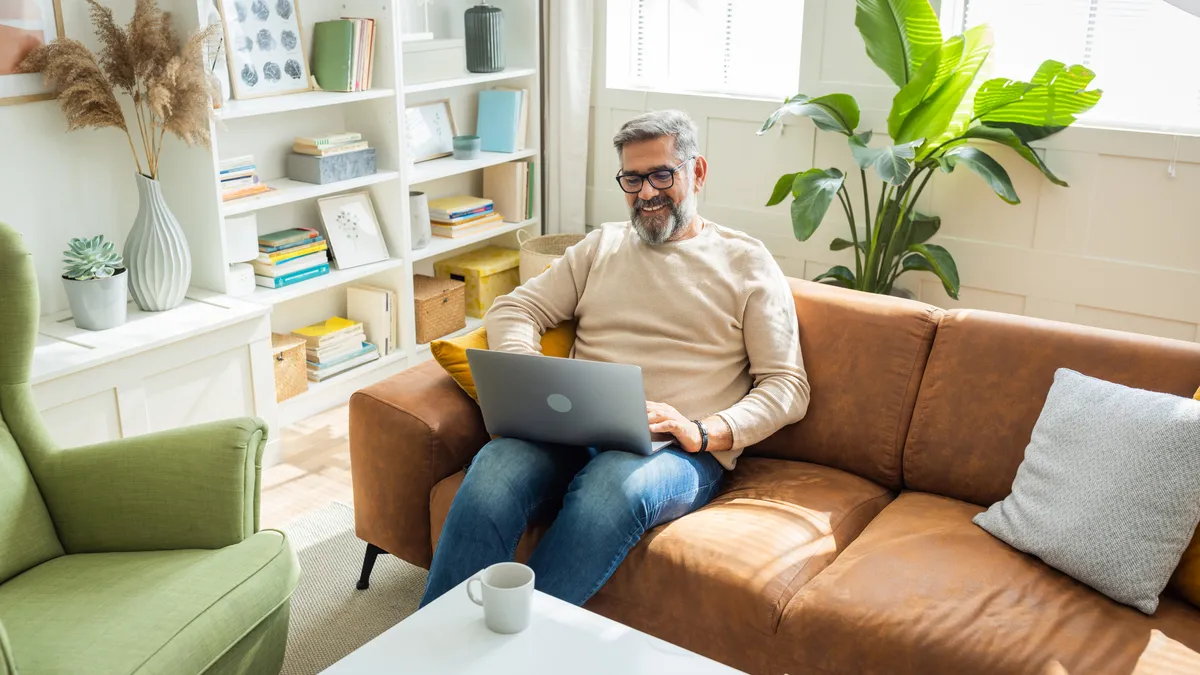 Mature man using a laptop