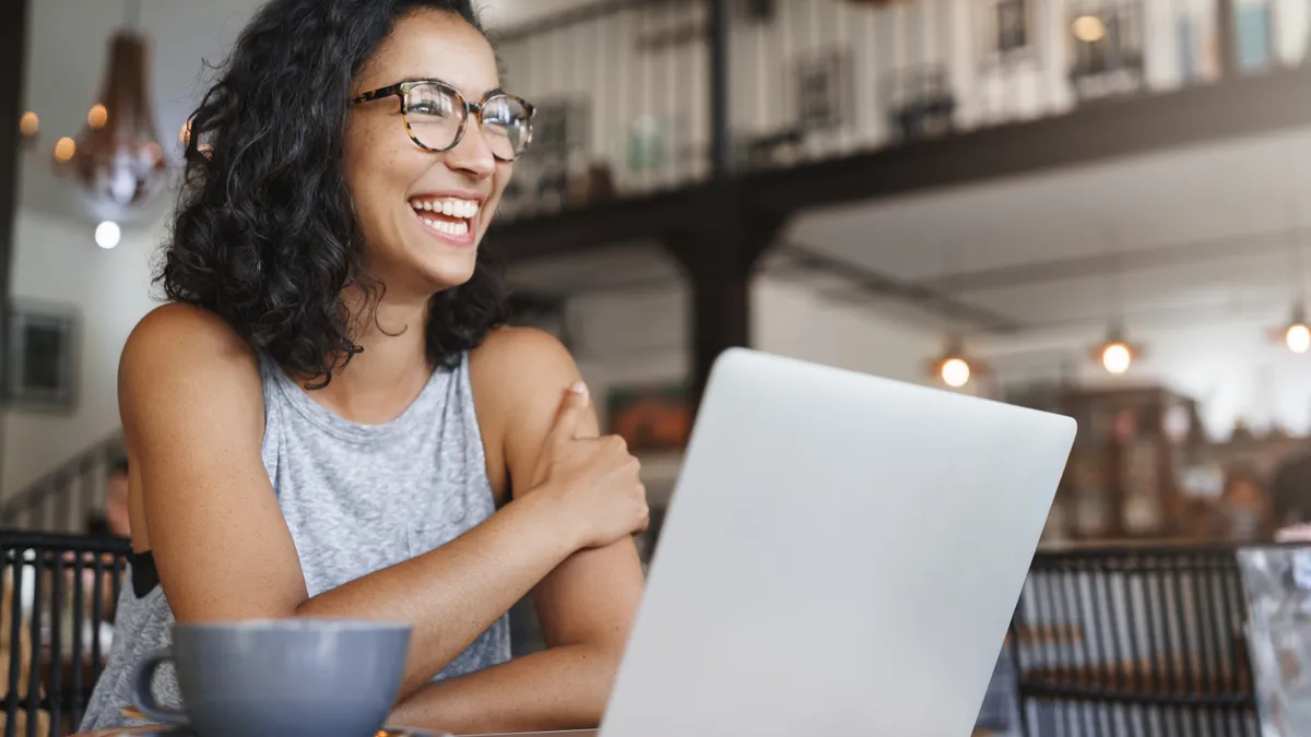 Carefree female working laptop